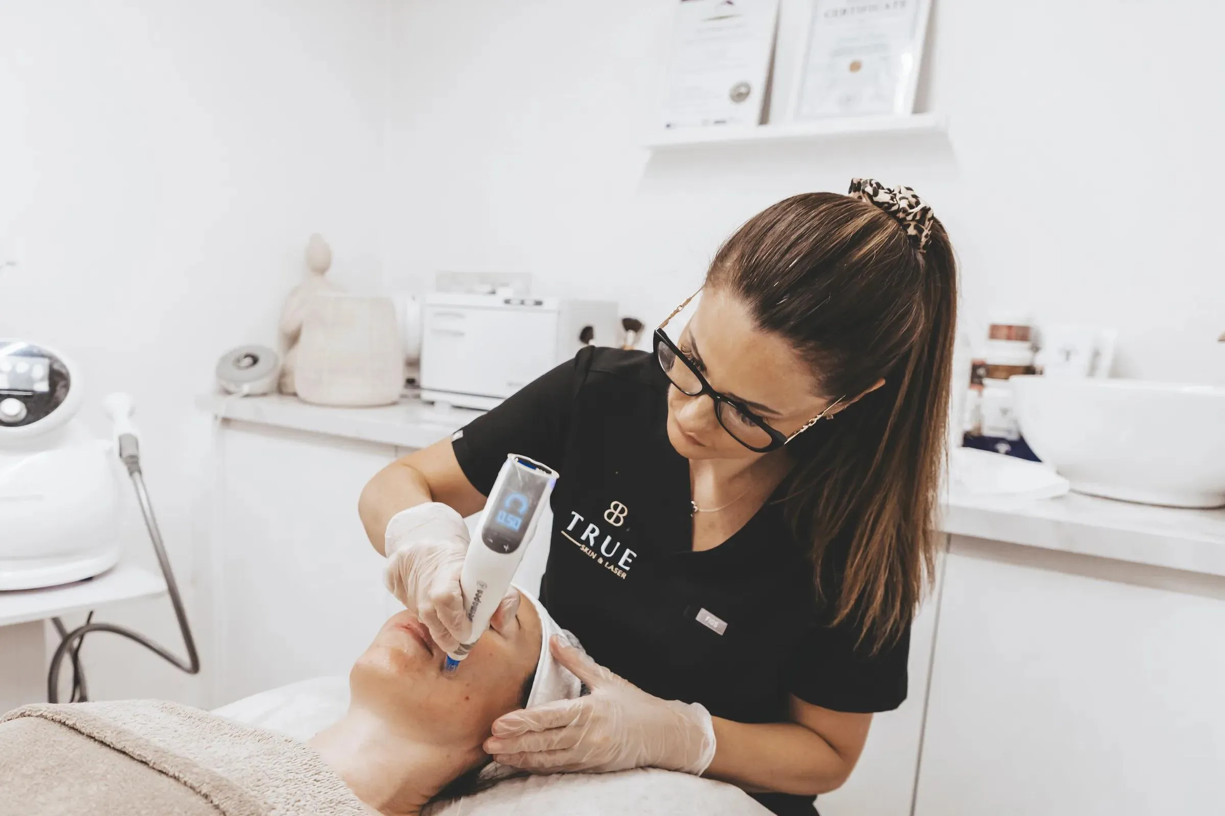 Sarah performing a microneedling treatment on a client at the True Skin and Laser clinic