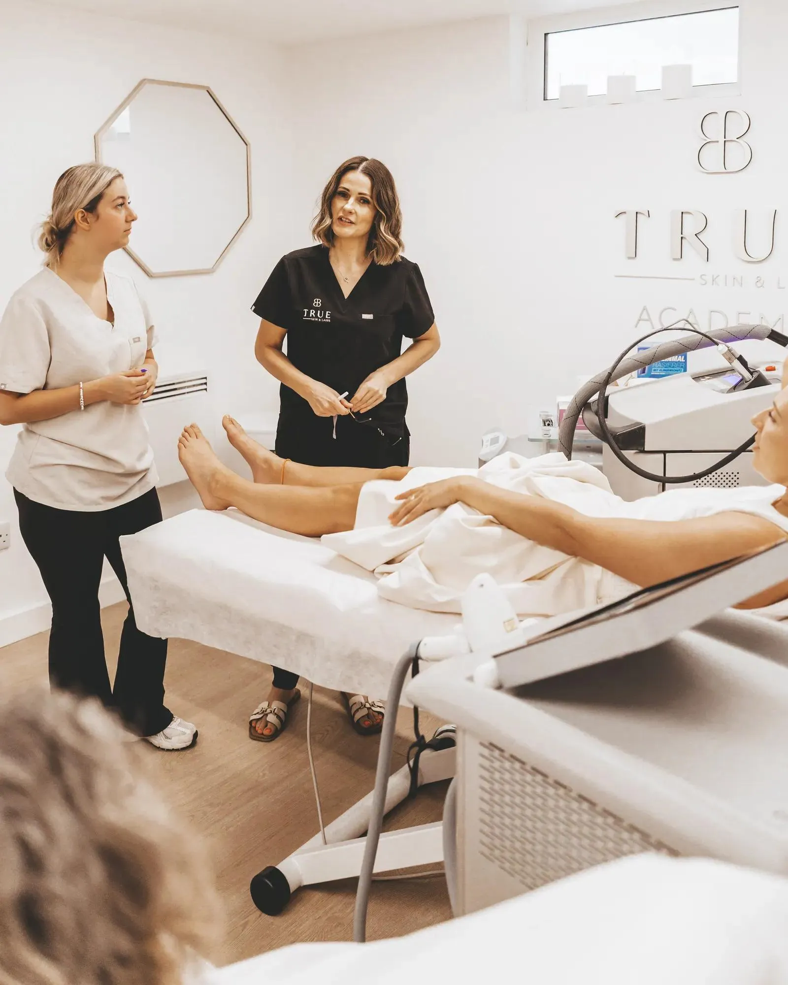 A practitioner performing laser treatment, ready to work
