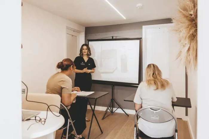 Sarah teaching an anatomy session to two students at the academy