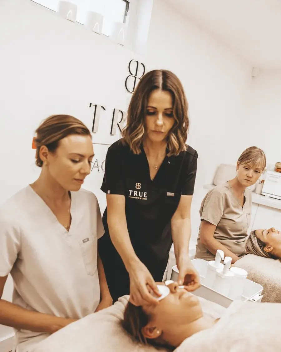 A facial treatment being demonstrated on a model during training