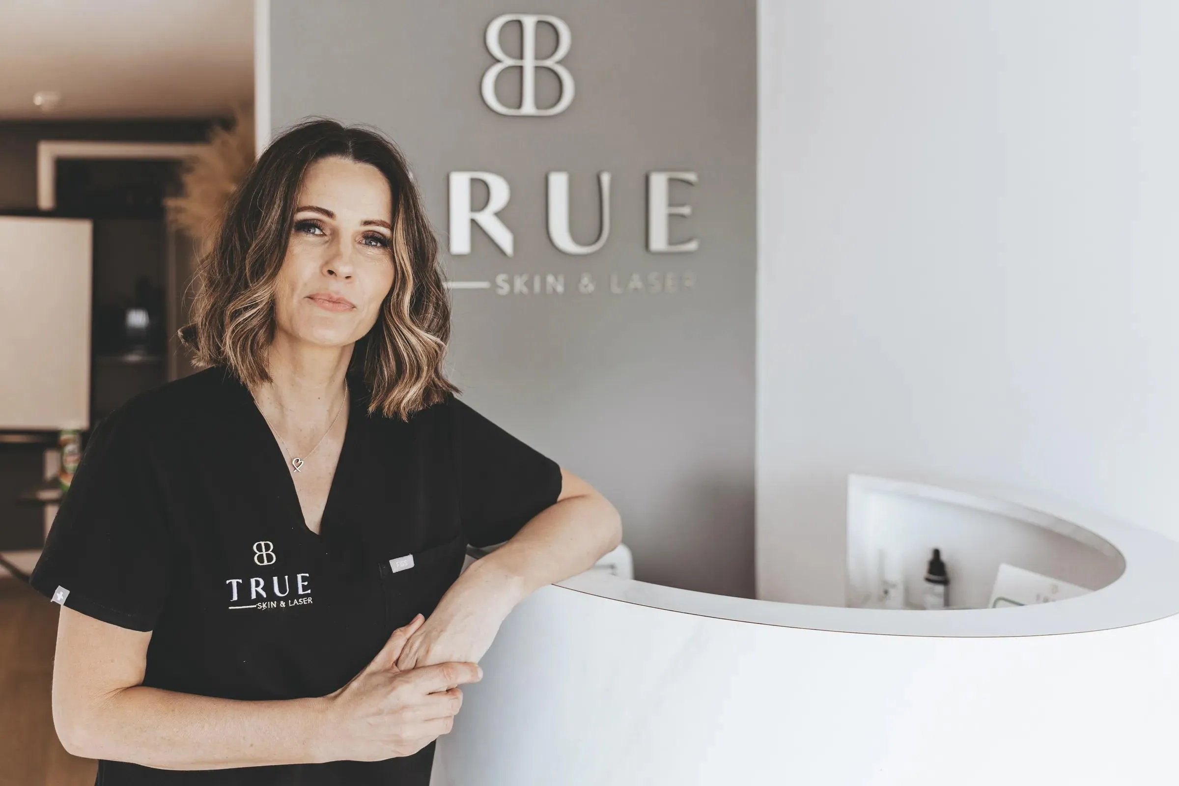 Sarah, founder of True Skin and Laser Academy, at the clinic reception